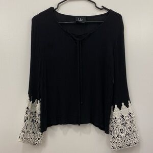 Lace-up front top with crochet lace sleeves